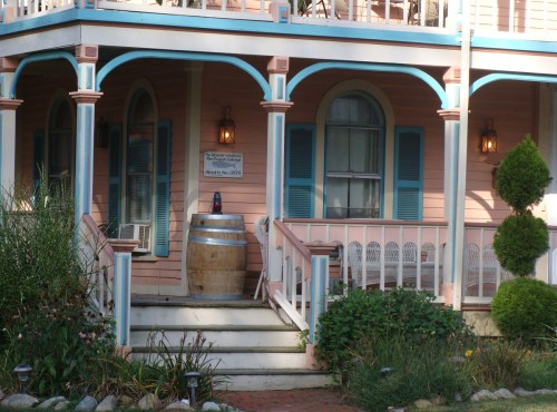 The woman who lives here has a miniature dachshund. It isn't very friendly and she warns me it may attack Makita.  It is about the size of Makita's head.  We've never seen anyone sit on this porch. But Becky will tell us a story of this porch's ghosts. 